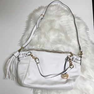 White Michael Kors crossbody with fringe tassel